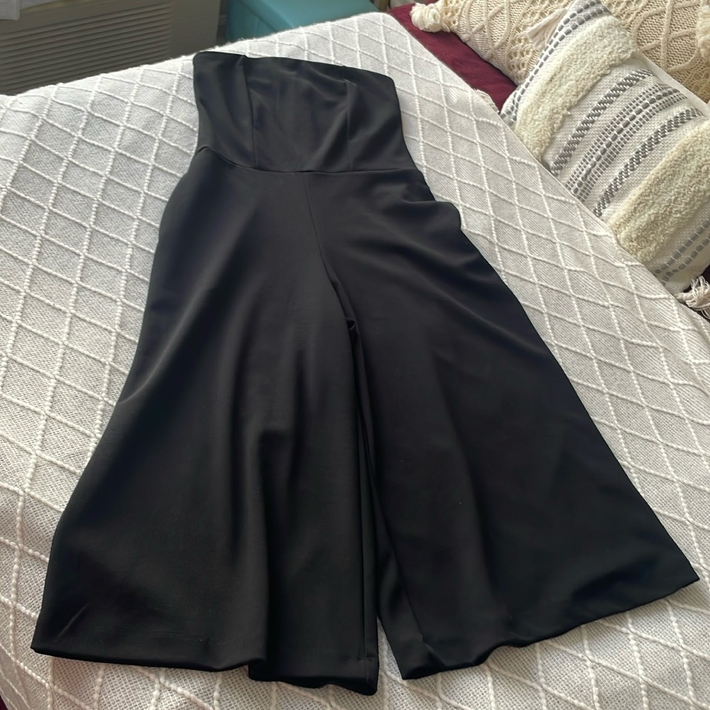 Black jumpsuit 
Hold up the chest with stopper